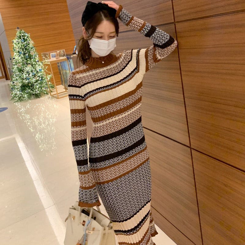 Striped knit sweater dress with long sleeves and a high neckline.