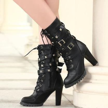 Black leather high-heeled combat boots with buckles and laces.