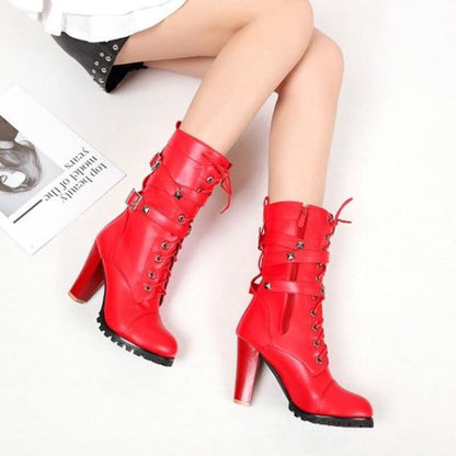 Bright red high-heeled boots with laces and buckle details.