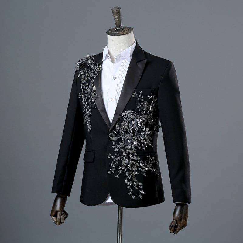 Elegant black blazer with intricate silver floral embroidery on the lapel and shoulder.