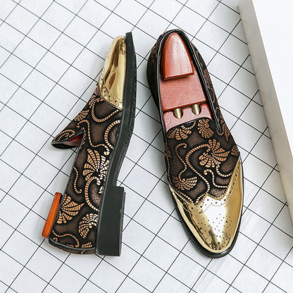 Pair of ornate loafers with gold floral embroidery and metallic accents.