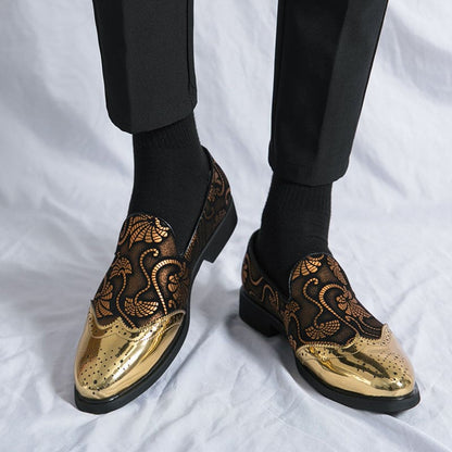 Ornate gold and black loafers with intricate floral patterns.