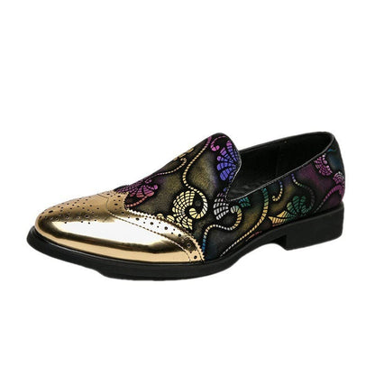 Ornate loafer with metallic gold toe and colorful embroidered floral patterns on black leather.