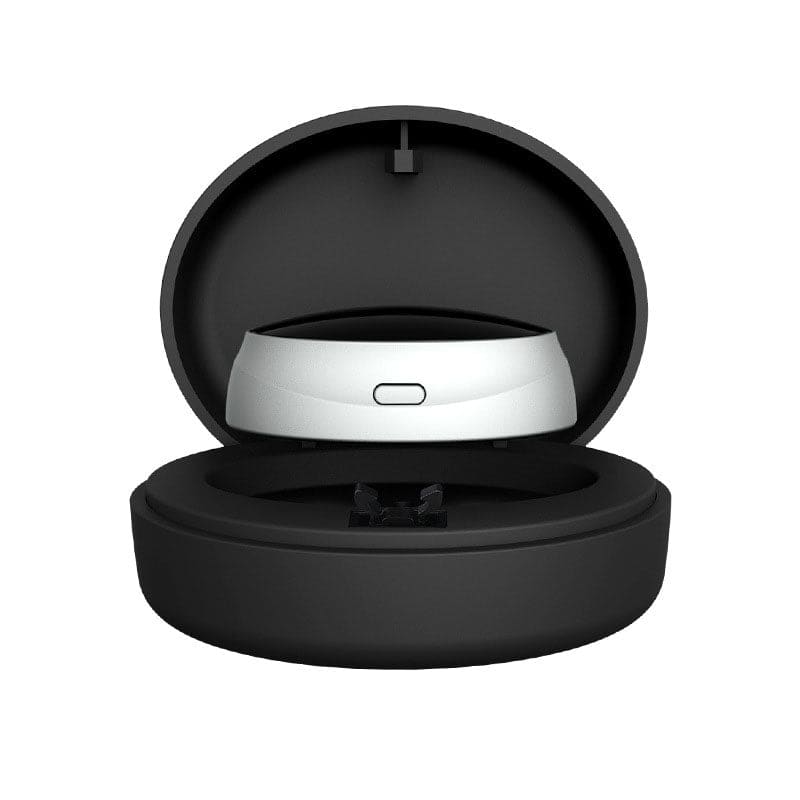 Circular black case containing a white electronic device.