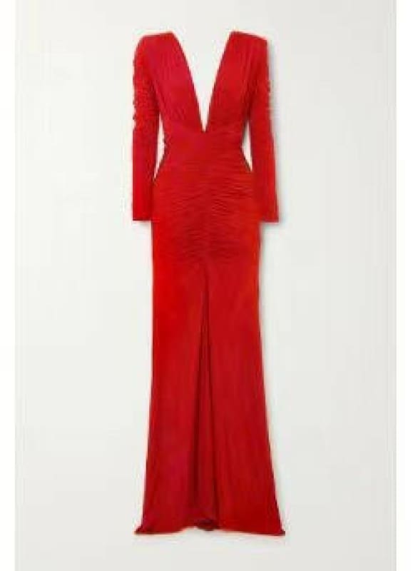 Long, form-fitting red gown with a plunging neckline and long sleeves.