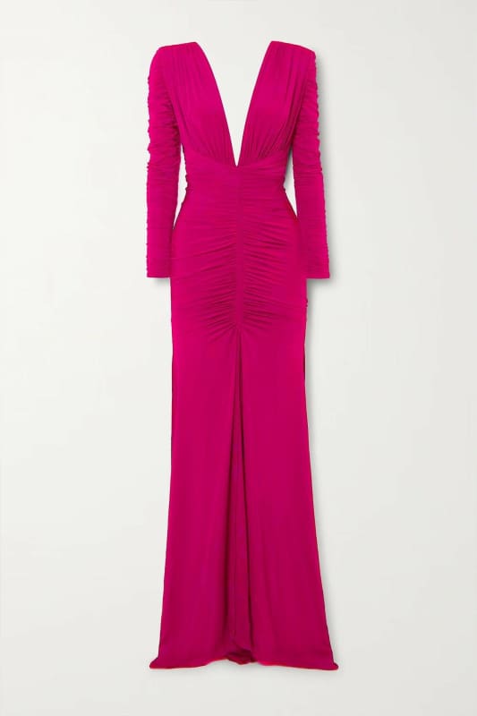 Vibrant fuchsia floor-length gown with a plunging neckline and long sleeves.