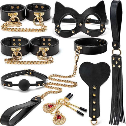 Collection of black leather BDSM accessories and bondage gear with gold-colored metal accents.