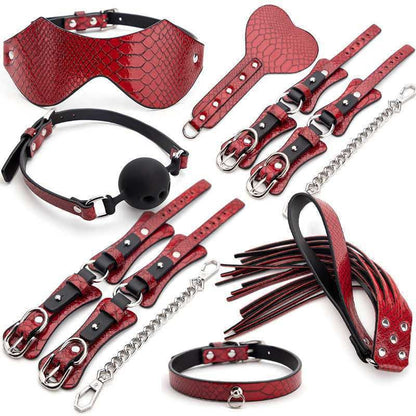 Collection of red leather BDSM accessories and restraints.