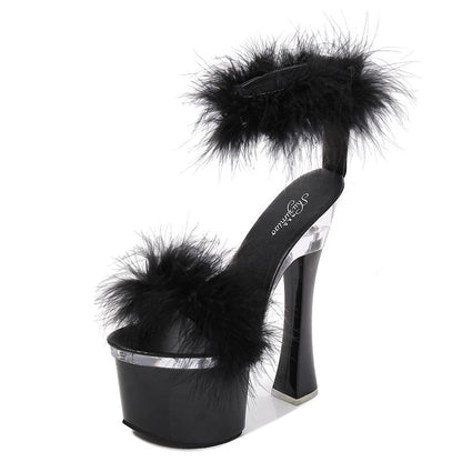 Black high-heeled platform sandal with fluffy feather accents.