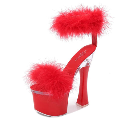 Red high-heeled platform sandal with fluffy feather accents.