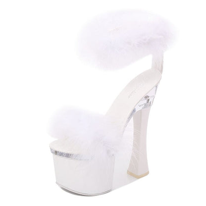 White platform high heel shoe with a fluffy fur-like top.