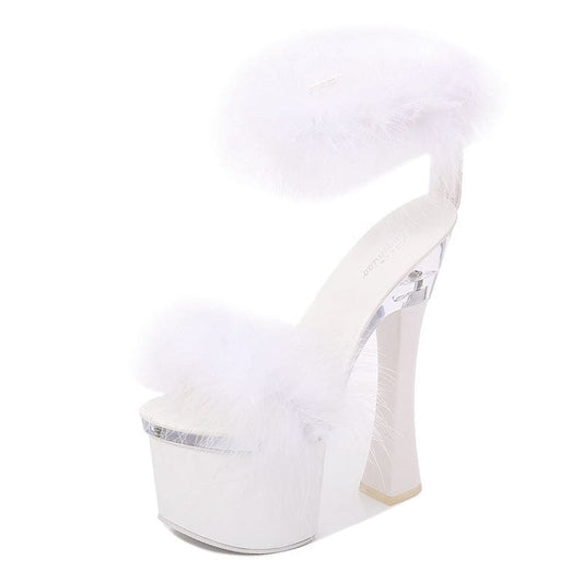 White platform high heel shoe with a fluffy fur-like top.