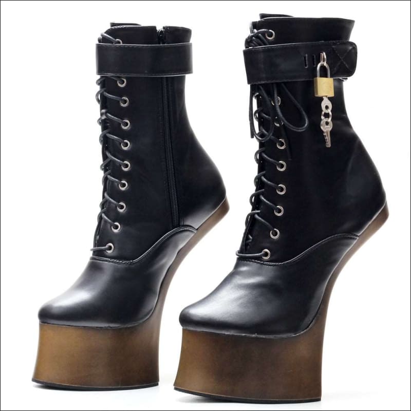 Pair of black leather platform boots with laces and a padlock accessory.