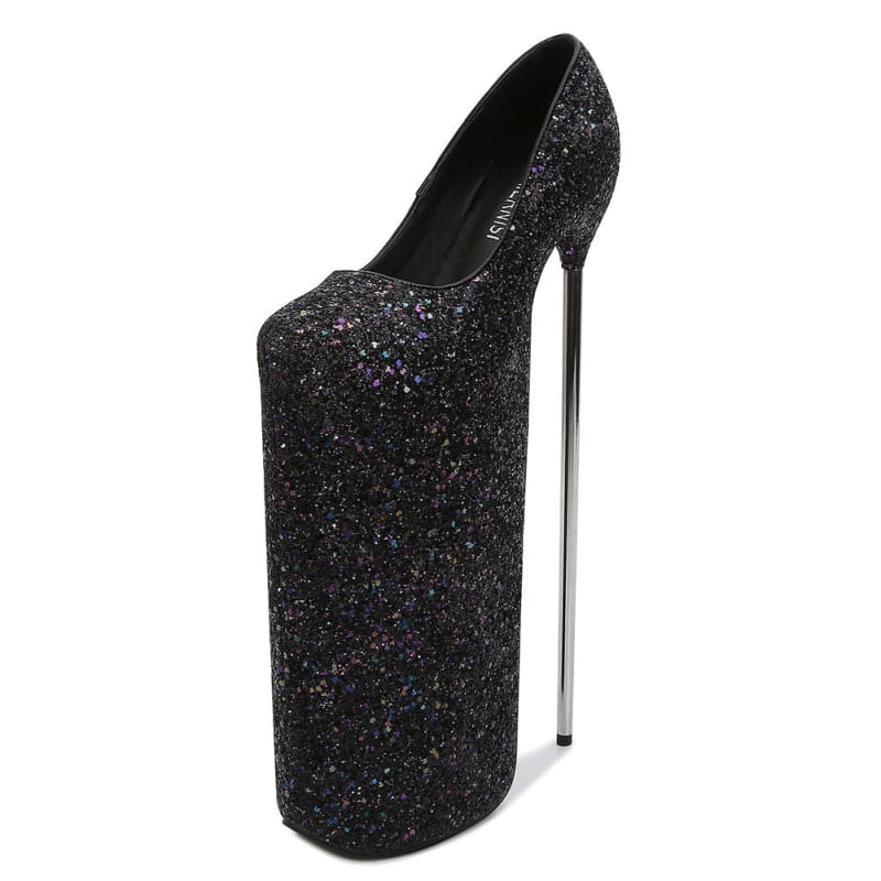 Extremely high-heeled black glittery platform shoe with an exaggerated platform sole.