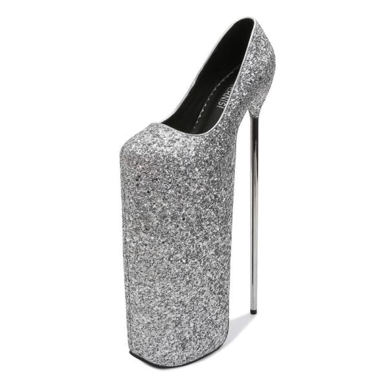 Extremely high-heeled silver glitter platform shoe with an exaggerated sole.