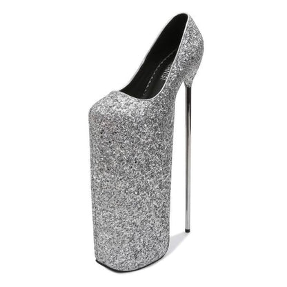 Extremely high-heeled silver glitter platform shoe with an exaggerated sole.