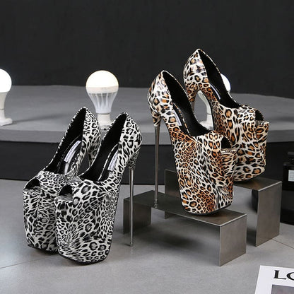 Pair of extremely high platform stiletto heels with leopard print patterns.