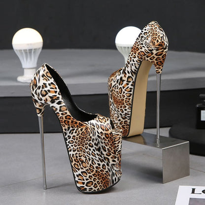 Pair of extremely high-heeled leopard print platform shoes with metallic stiletto heels.