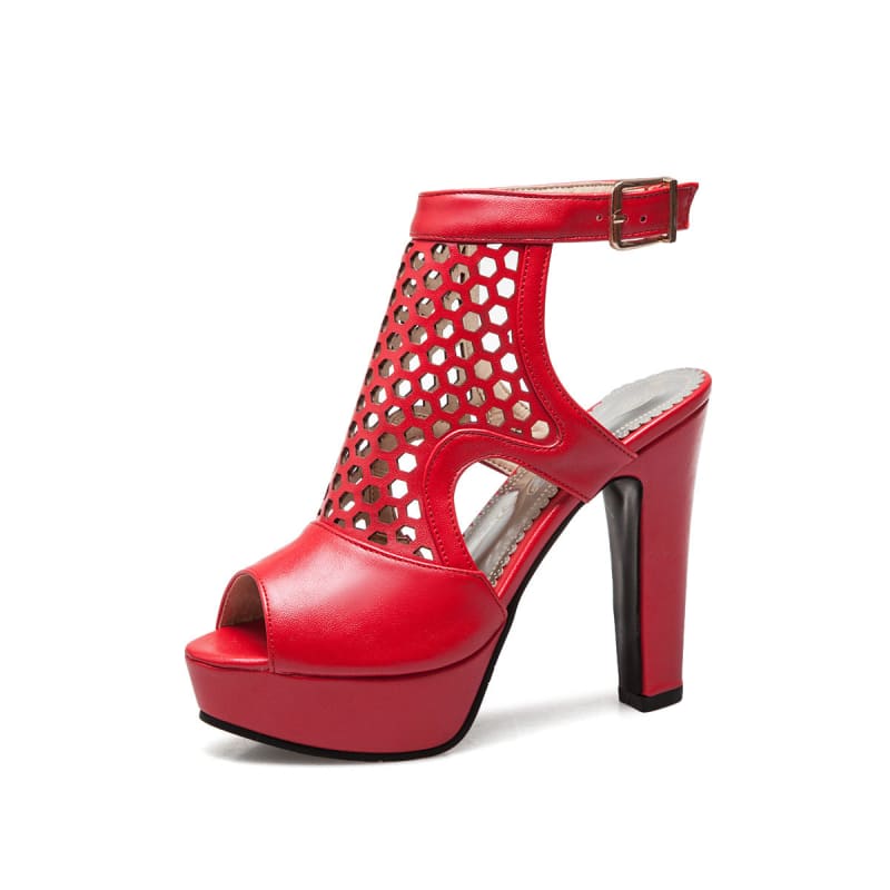 Red high-heeled platform sandal with perforated upper and ankle strap.