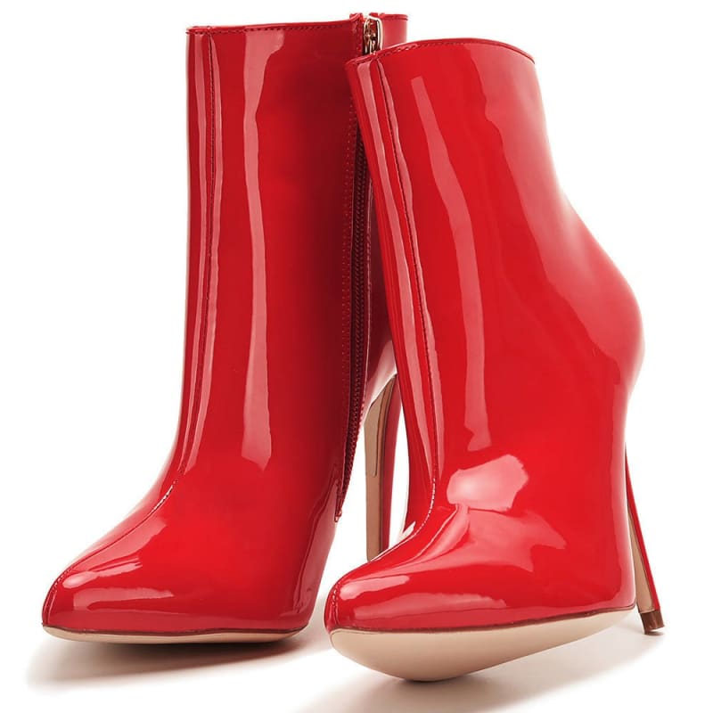 Pair of glossy red high-heeled ankle boots with side zippers.