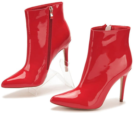 Pair of glossy red high-heeled ankle boots with pointed toes and side zippers.