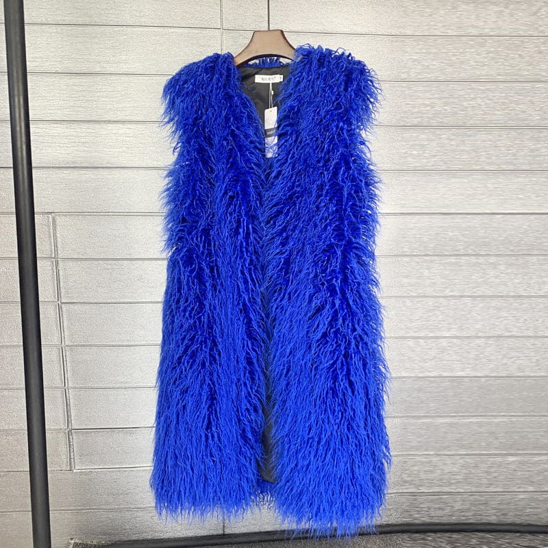 Vibrant blue fluffy sleeveless vest or gilet hanging on a clothes hanger.