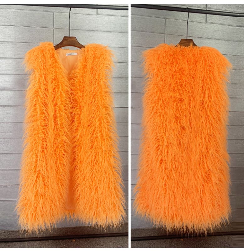 Bright orange fluffy sleeveless vest or gilet with long shaggy fur-like texture.