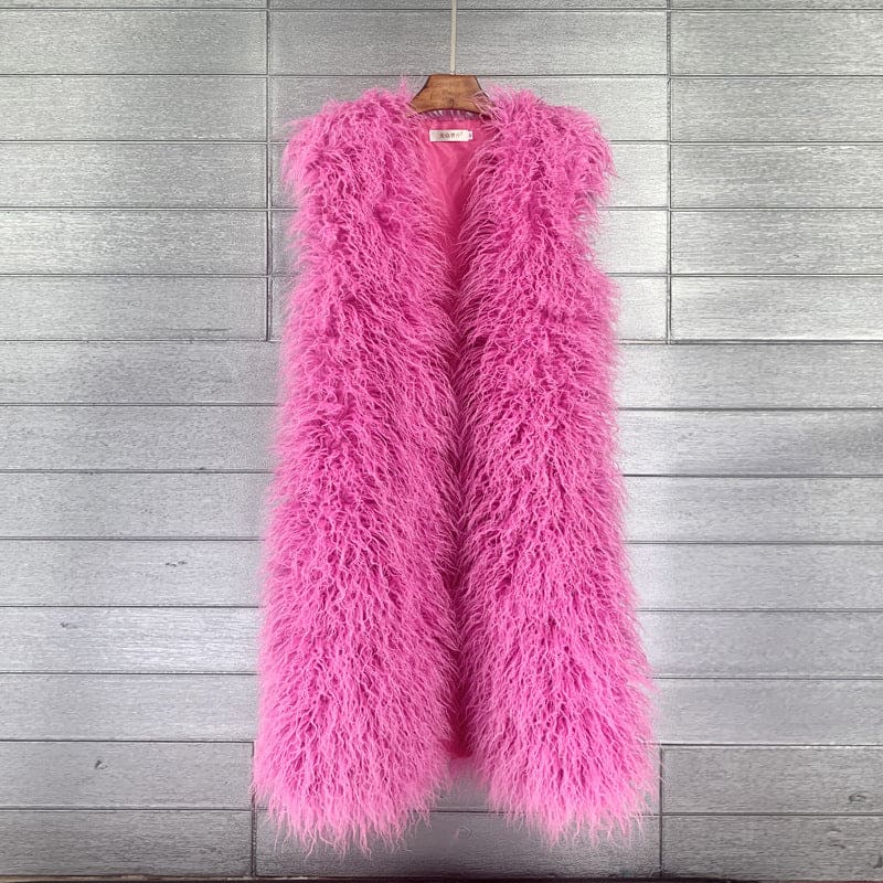 Bright pink fluffy sleeveless vest hanging on a wooden hanger.