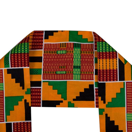 Colorful patterned fabric with geometric designs in orange, green, red, and black, resembling traditional African kente cloth.