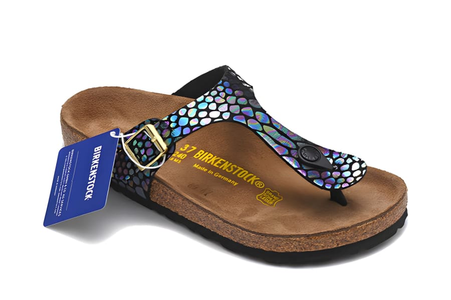 Colorful sandal with a shimmery snake-print strap and cork footbed.