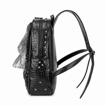 Black leather backpack with studded detailing and multiple compartments.