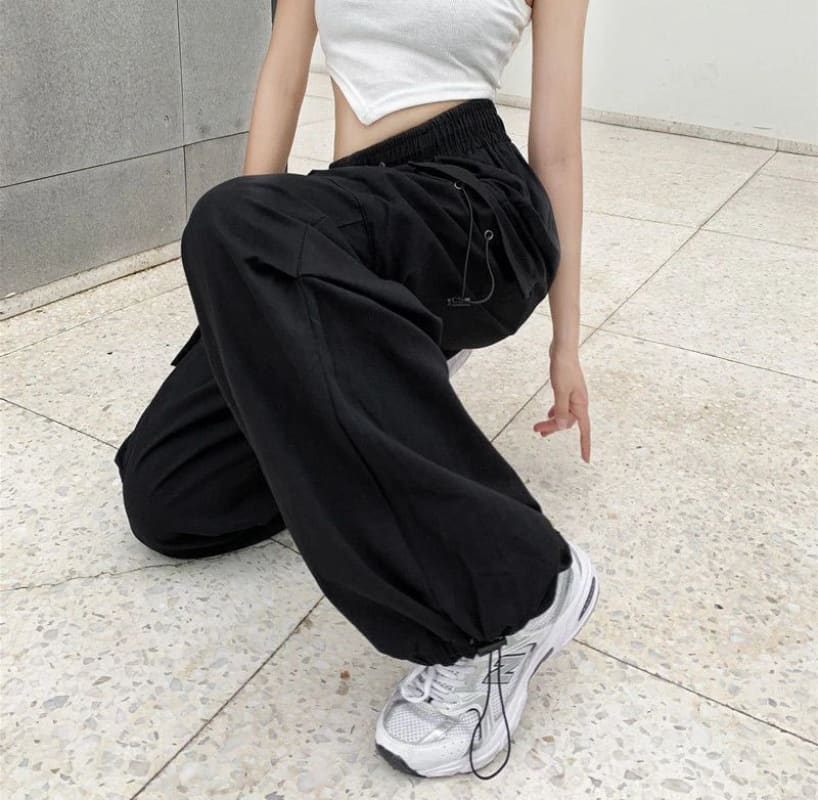 Women’s black wide and baggy leg cargo pants with high waist