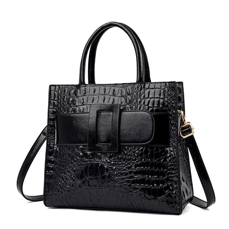 Black leather handbag with crocodile texture and a front buckle detail.