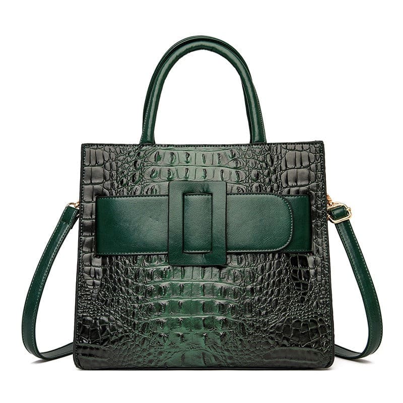 Dark green crocodile-textured leather handbag with a prominent front buckle and shoulder strap.