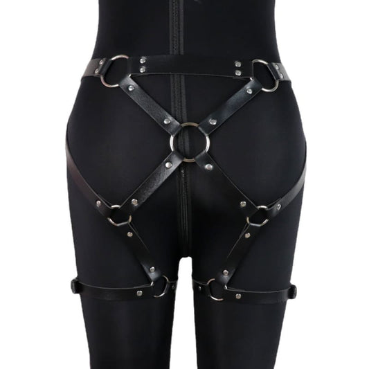 Black leather harness with metal rings and studs worn around the hips and thighs.