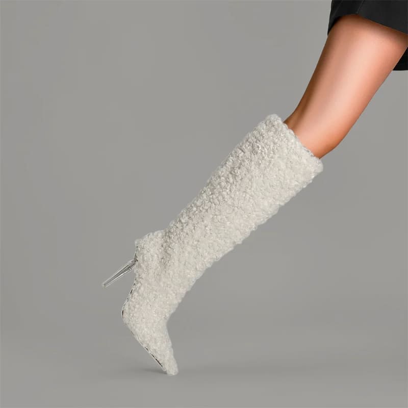 White furry knee-high pointed toe boots with crystal transparent heel for stylish looks.