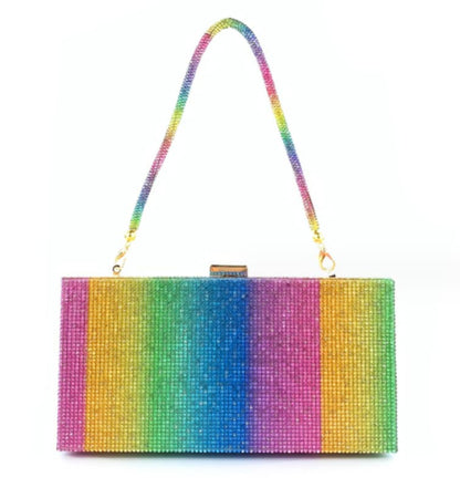 Rainbow-colored clutch purse with a textured, shimmering surface and gold hardware.