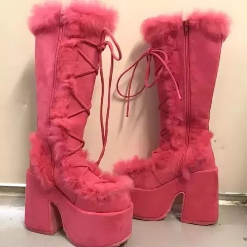 Pink faux fur round toe platform boots with lace-up front and chunky heels for winter.