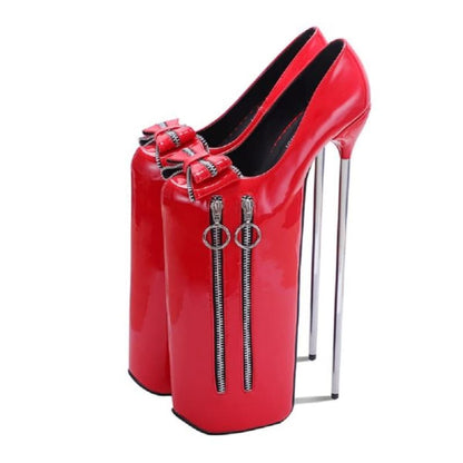 Extremely high platform stiletto shoe in bright red with decorative zippers and bows.